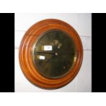 An antique circular wall clock by John Bell of Sou
