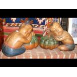 A pair of carved wooden Oriental style sleeping ch