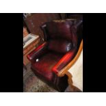 A Victorian style wing easy chair