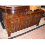 A reproduction carved oak blanket box - width 121.