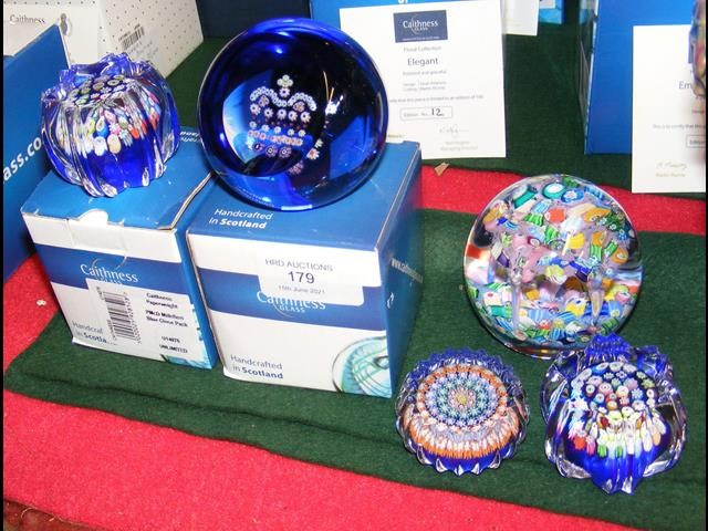 Two boxed Caithness paperweights together with thr