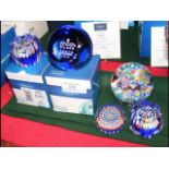 Two boxed Caithness paperweights together with thr
