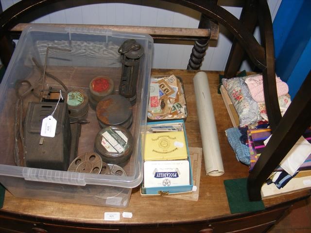 A vintage film projector and reels, together with