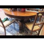 A Victorian circular mahogany dining table on shap