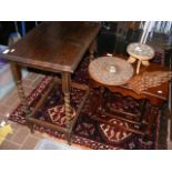 A nest of oak tables together with a barley twist