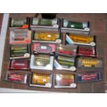 A selection of 14 boxed die cast model busses and