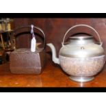 Two oriental metal teapots
