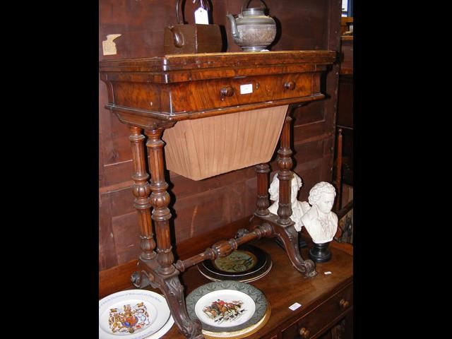 A walnut needlework table