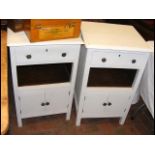 A pair of shabby chic bedside cupboards