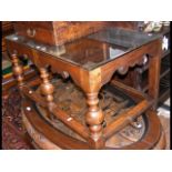 A glass top oak coffee table - width 88cm