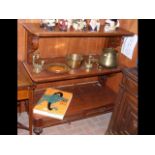 A Victorian mahogany three tier buffet with two dr