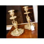 A pair of decorative 22cm high candlesticks