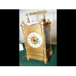 A decorative 16cm high brass cased carriage clock
