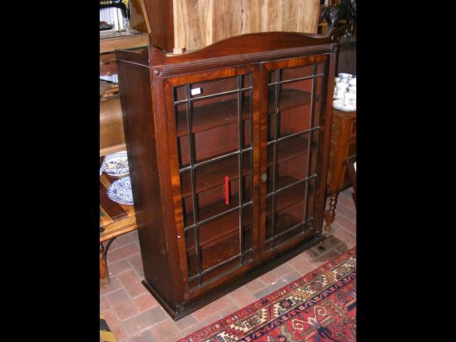 An antique bookcase top only