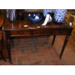A Victorian plum mahogany desk with two drawers to the