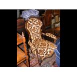 A Victorian button back easy chair on cabriole fro