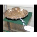 A pierced silver shell dish - 18cms long
