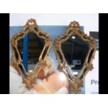 A pair of decorative metal hall mirrors - 64cm lon