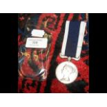 A Naval Long Service and Good Conduct medal with r