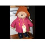 A 45cm high Paddington Bear in red overcoat