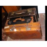 A vintage leather suitcase, together with two othe