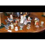 A medley of Beswick bird ornaments and clown ornam