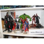 A collection of Marvel and DC comic book figures a