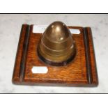 A brass Trench art inkwell