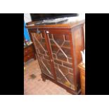 A mahogany bookcase with glazed doors to front