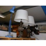 A pair of large table lamps together with a blue a