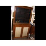 A 19th century rosewood bookcase with cupboards be