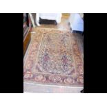 An antique Middle Eastern carpet with geometric bo