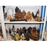 Two shelves of Buddha ornaments