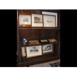 An assortment of framed and glazed prints and engr