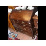 A period oak bureau with fitted interior and drawe