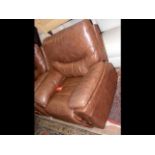 A brown leather style electric reclining chair