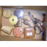 A selection of collectable compacts, together with a selection of wrist watches