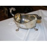 A silver sauce boat with scroll handle, London 190