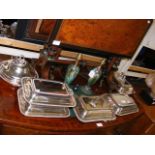 A pair of silver plated entree dishes together wit