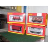 Four boxed Hornby wagons