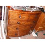 An early 19th century mahogany bow fronted chest o