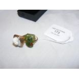 A yellow metal ring set with jade, together with a