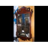 An antique mahogany framed fretwork mirror - heigh