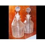 A pair of early 19th century cut glass decanters o