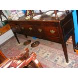 A Georgian oak dresser with three drawers under -