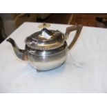 A silver teapot with reeded decoration - London 18