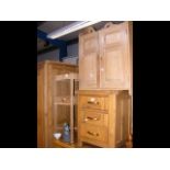 A pine hanging cupboard, together with a plant sta