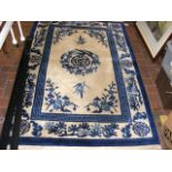 A Middle Eastern style rug with blue and cream gro