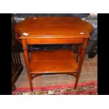 An antique two tier occasional table