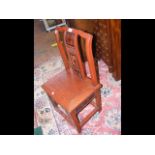 A Chinese red lacquered side chair with pierced de